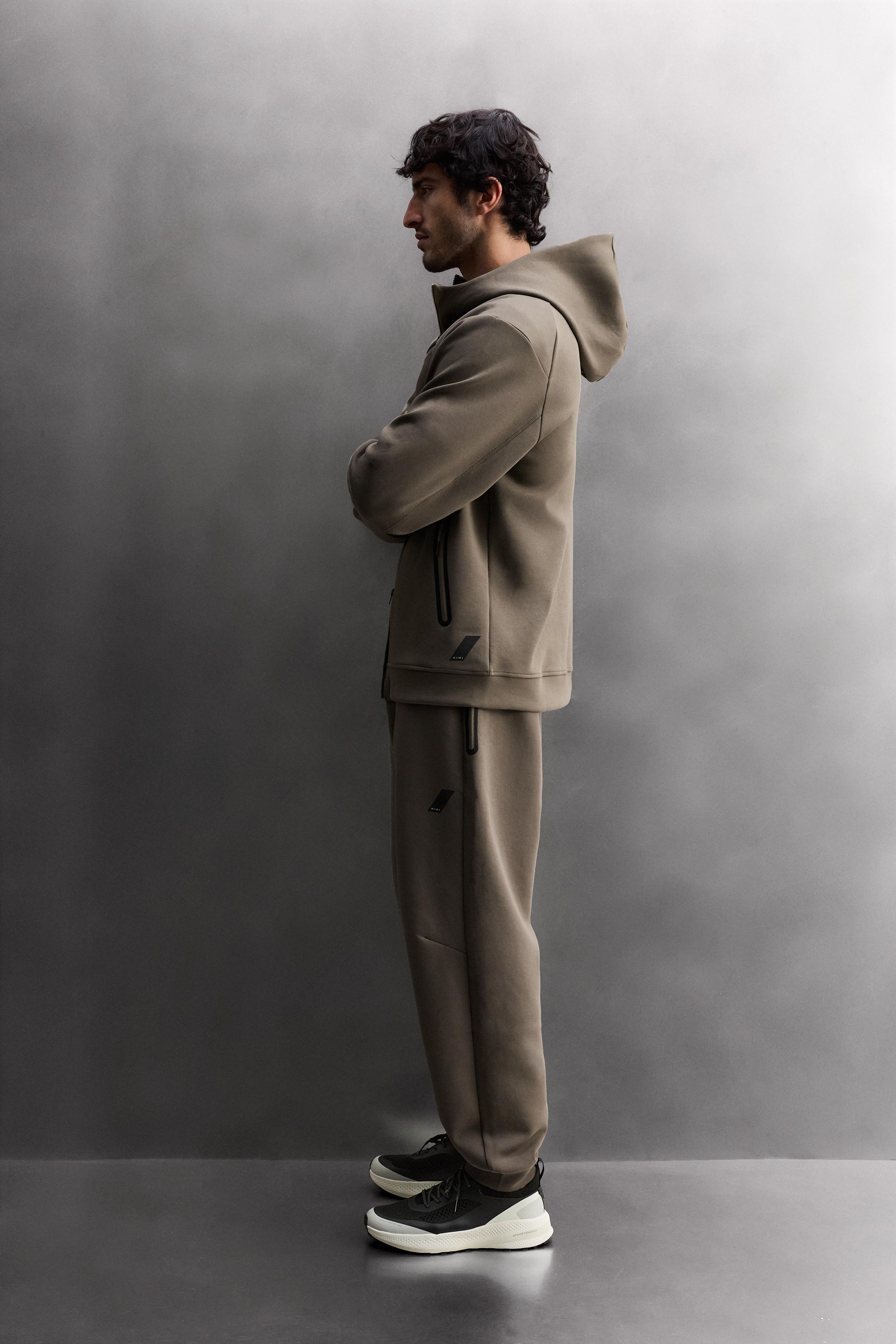 SWEAT TECHNIQUE ZIPPÉ À CAPUCHE